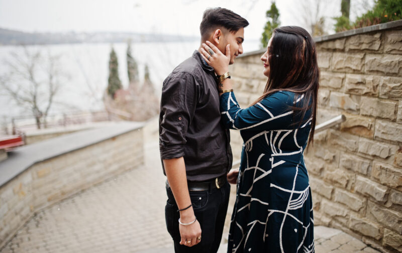 Love story of indian couple posed outdoor.